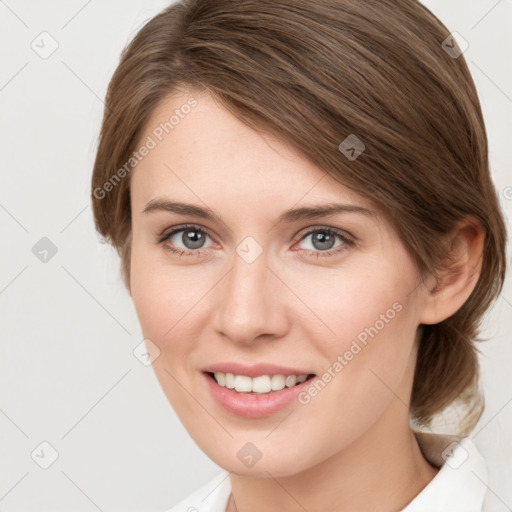 Joyful white young-adult female with medium  brown hair and green eyes