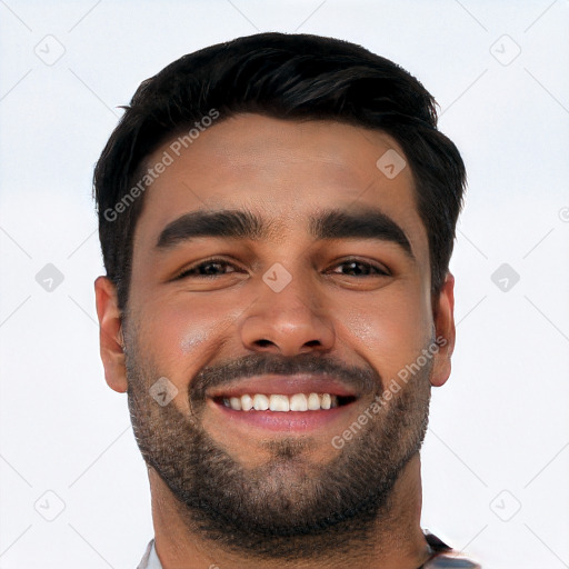 Joyful white young-adult male with short  black hair and brown eyes