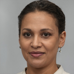 Joyful white adult female with short  brown hair and brown eyes