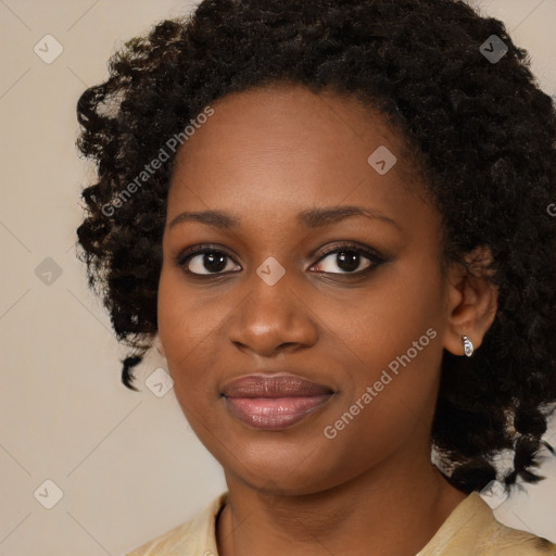 Joyful black young-adult female with medium  black hair and brown eyes