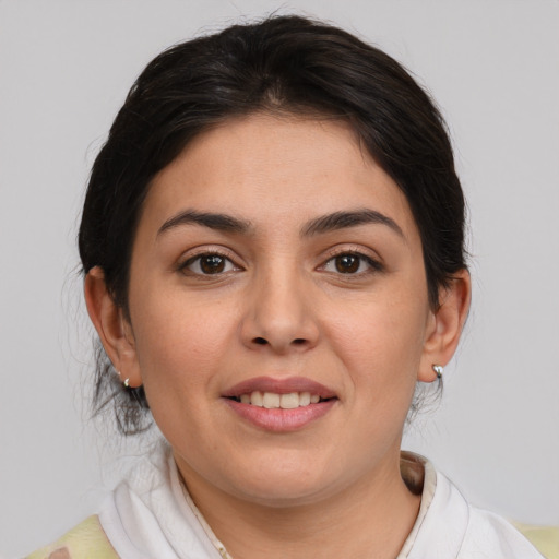 Joyful white young-adult female with medium  brown hair and brown eyes