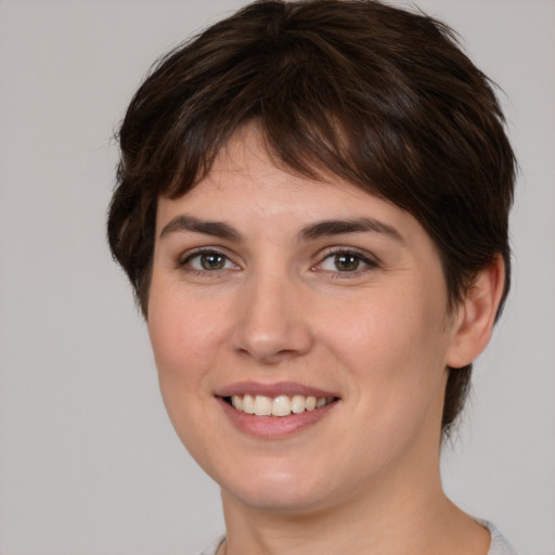 Joyful white young-adult female with medium  brown hair and brown eyes