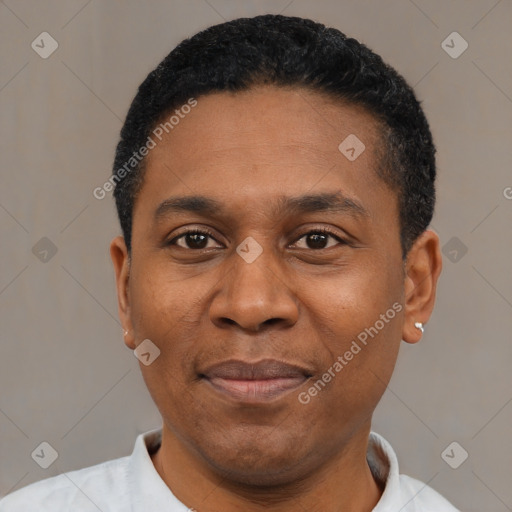 Joyful latino adult male with short  black hair and brown eyes