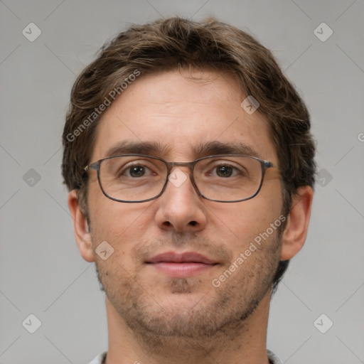 Joyful white adult male with short  brown hair and grey eyes