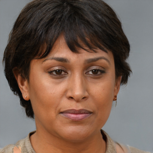 Joyful asian adult female with medium  brown hair and brown eyes