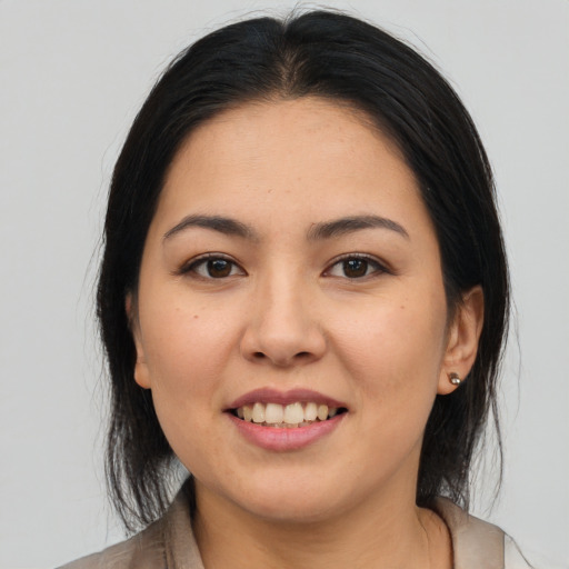 Joyful asian young-adult female with medium  brown hair and brown eyes