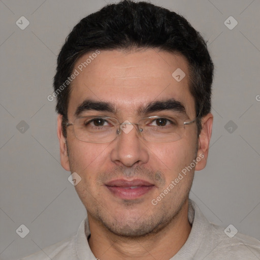 Joyful white adult male with short  black hair and brown eyes