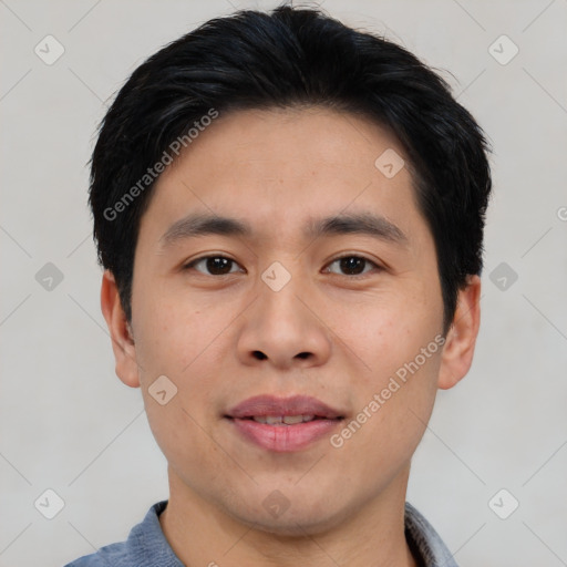 Joyful asian young-adult male with short  black hair and brown eyes