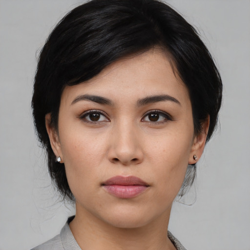 Joyful asian young-adult female with medium  black hair and brown eyes
