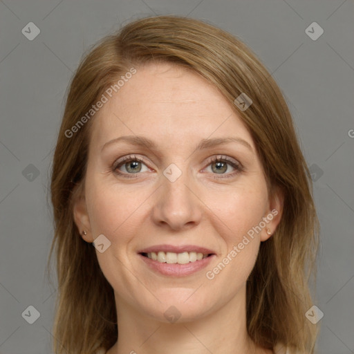 Joyful white adult female with medium  brown hair and grey eyes