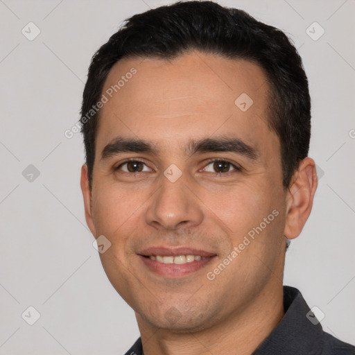 Joyful white young-adult male with short  black hair and brown eyes