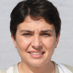 Joyful white adult female with short  brown hair and brown eyes