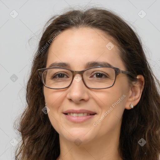 Joyful white adult female with long  brown hair and brown eyes