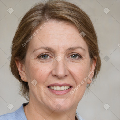 Joyful white adult female with medium  brown hair and grey eyes