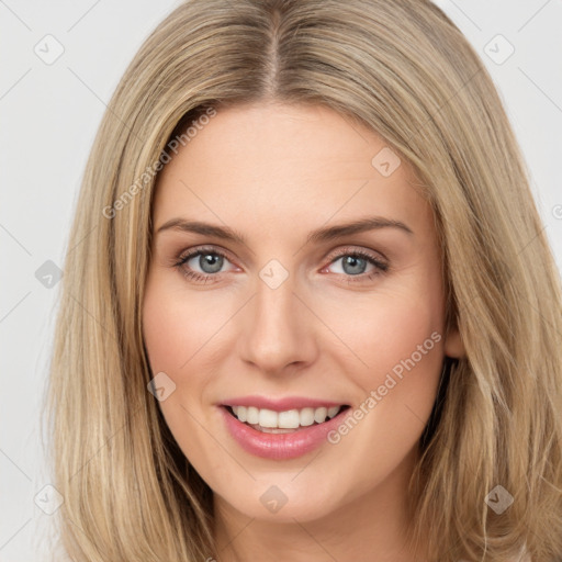 Joyful white young-adult female with long  brown hair and green eyes