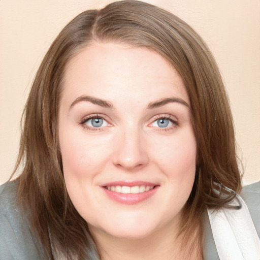 Joyful white young-adult female with medium  brown hair and blue eyes