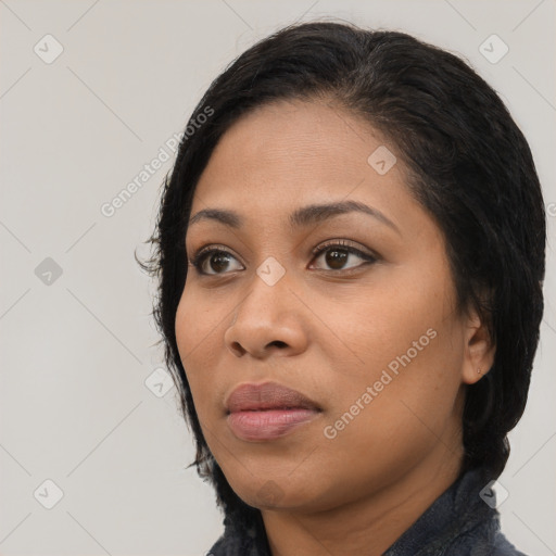 Joyful latino young-adult female with medium  black hair and brown eyes