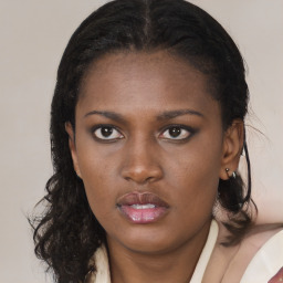 Neutral black young-adult female with medium  brown hair and brown eyes