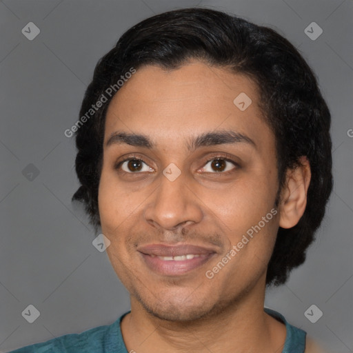 Joyful latino young-adult male with short  black hair and brown eyes