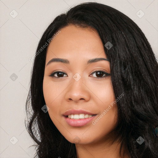 Joyful latino young-adult female with long  black hair and brown eyes