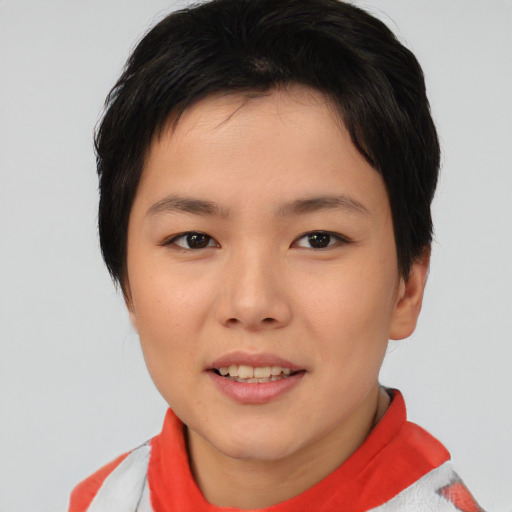 Joyful asian young-adult female with short  brown hair and brown eyes