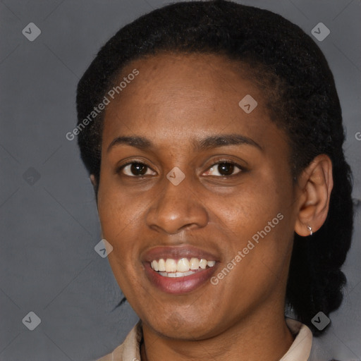 Joyful black young-adult female with short  brown hair and brown eyes