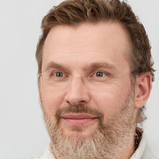 Joyful white adult male with short  brown hair and grey eyes