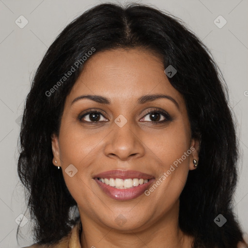 Joyful latino young-adult female with long  brown hair and brown eyes