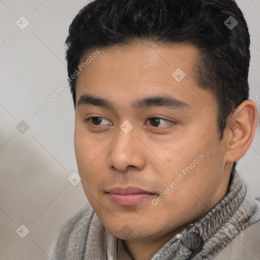 Joyful asian young-adult male with short  black hair and brown eyes