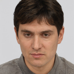 Neutral white adult male with short  brown hair and brown eyes