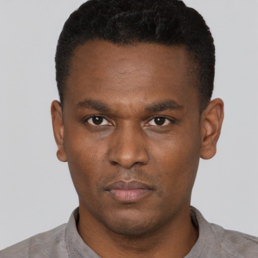 Neutral black young-adult male with short  black hair and brown eyes