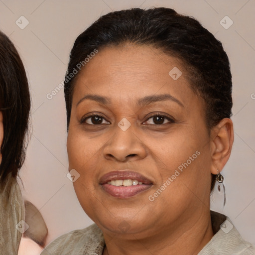 Joyful latino adult female with medium  brown hair and brown eyes