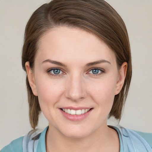 Joyful white young-adult female with medium  brown hair and blue eyes