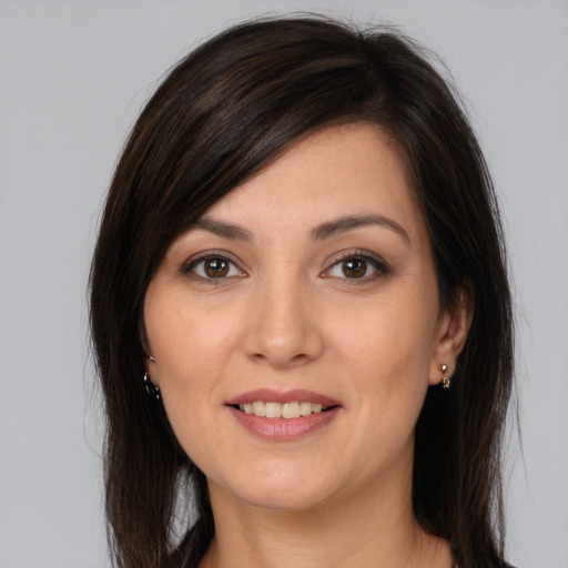 Joyful white young-adult female with medium  brown hair and brown eyes