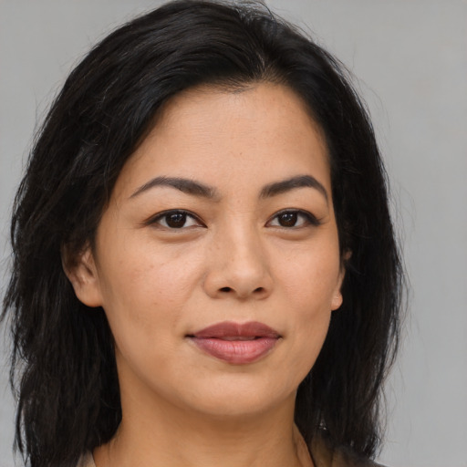 Joyful asian young-adult female with medium  brown hair and brown eyes