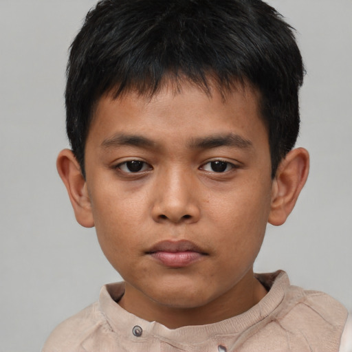 Neutral asian child male with short  brown hair and brown eyes