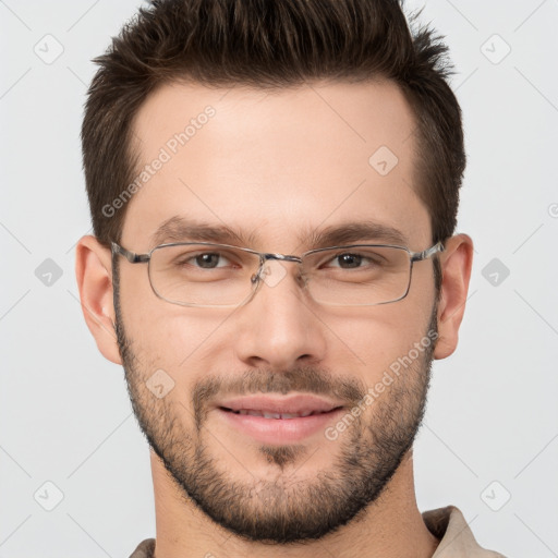 Joyful white young-adult male with short  brown hair and brown eyes