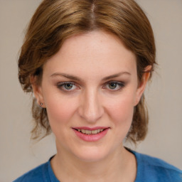 Joyful white young-adult female with medium  brown hair and blue eyes