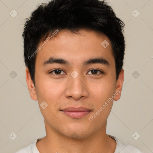 Joyful asian young-adult male with short  brown hair and brown eyes