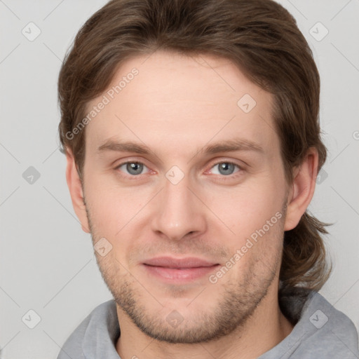 Joyful white adult male with short  brown hair and grey eyes