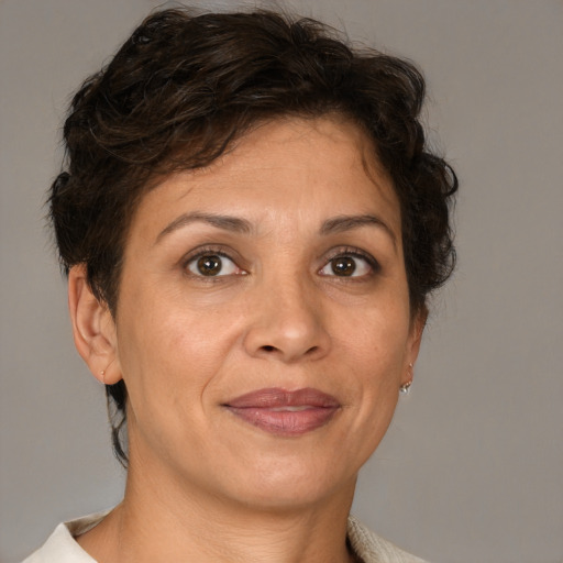 Joyful white adult female with short  brown hair and brown eyes