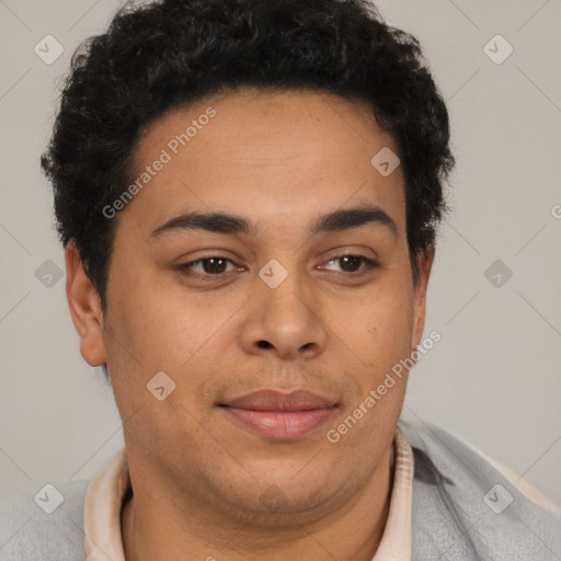 Joyful latino young-adult male with short  brown hair and brown eyes