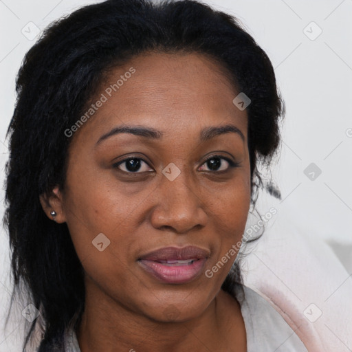 Joyful black adult female with medium  brown hair and brown eyes