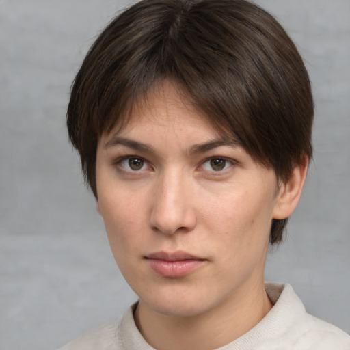 Neutral white young-adult female with medium  brown hair and brown eyes