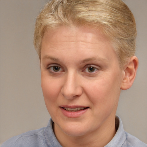 Joyful white adult female with short  brown hair and brown eyes