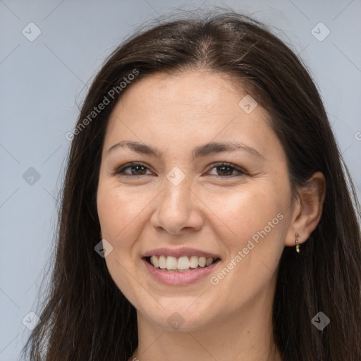 Joyful white young-adult female with long  brown hair and brown eyes