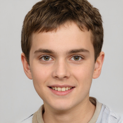 Joyful white child male with short  brown hair and brown eyes