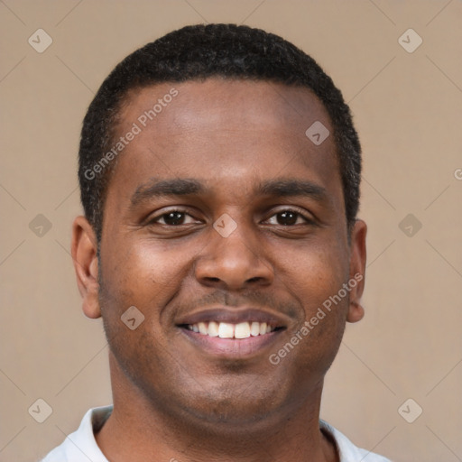 Joyful latino young-adult male with short  brown hair and brown eyes