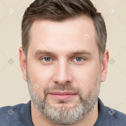 Neutral white adult male with short  brown hair and grey eyes