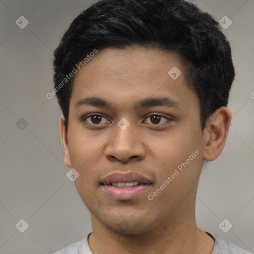 Joyful latino young-adult male with short  black hair and brown eyes